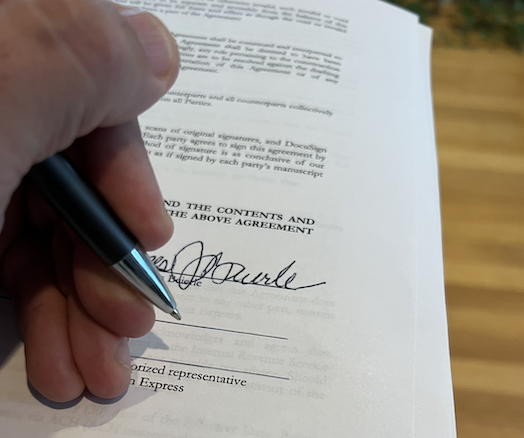 Hand signing contract, for construction, loan, or credit card debt 
