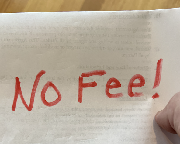 Hand holding "no fee" 