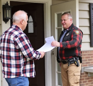 A sheriff going to the door a person being served with a Complaint in PA